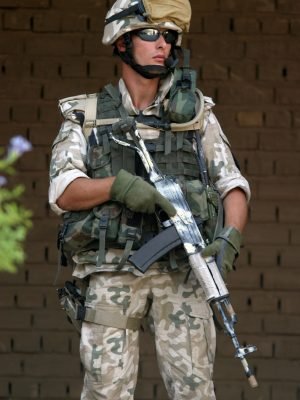 A Polish Army Soldier armed with a TANTAL assault rifle stands guard outside the amphitheater during the opening of the Relief in Place (RIP) Ceremony as US Marine Corps (USMC) Marines assigned to the 1st Marine Expeditionary Force (I MEF) relinquish authority to the Polish lead coalition forces, during a ceremony at Camp Babylon, Iraq, during Operation IRAQI FREEDOM.